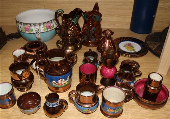 A collection of Victorian copper lustre jugs and a chamber pot